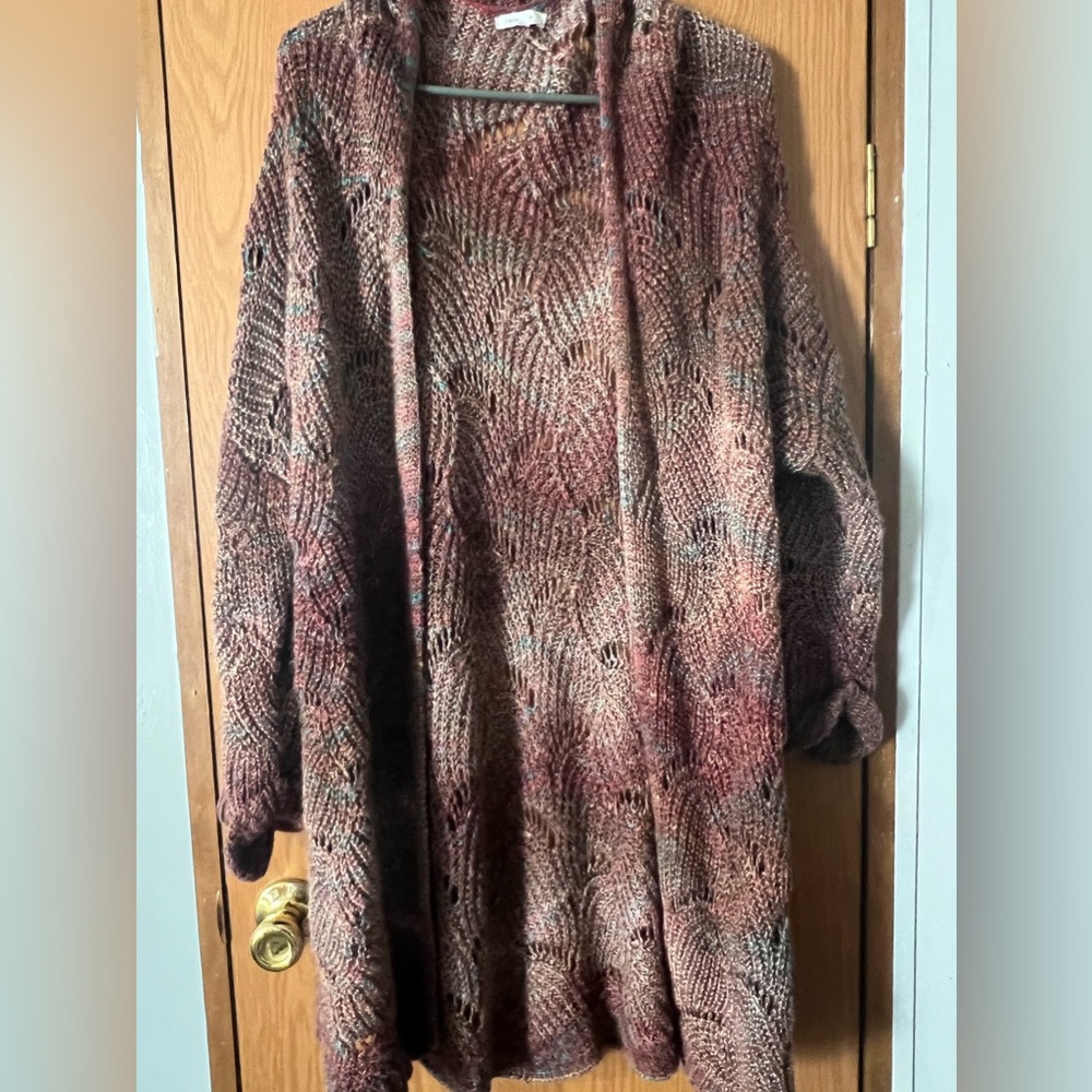 Maurice’s colorful cardigan